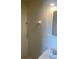 Tiled bathroom with a modern vanity and a shower area at 3641 Dickens Dr, Holiday, FL 34691