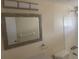 Well-lit bathroom featuring tiled shower and neutral wall color at 3641 Dickens Dr, Holiday, FL 34691