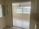 Open dining area featuring tile flooring and view to the exterior at 3641 Dickens Dr, Holiday, FL 34691