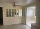 Open-concept dining area with tile flooring, ceiling fan, and connection to kitchen at 3641 Dickens Dr, Holiday, FL 34691