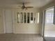 Dining area with tile flooring, ceiling fan, and open view to another room at 3641 Dickens Dr, Holiday, FL 34691
