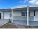 A close-up of the front porch and garage of a single Gathering home at 3641 Dickens Dr, Holiday, FL 34691