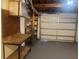 Basement garage featuring ample shelving and workbench space at 3641 Dickens Dr, Holiday, FL 34691