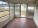 Enclosed patio with a window-mounted air conditioner unit at 3641 Dickens Dr, Holiday, FL 34691
