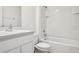 Bathroom featuring a tub/shower combo and a single sink vanity at 37237 Sharks Eye Ln, Zephyrhills, FL 33541