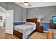 Comfortable bedroom featuring a bed, wood floors, and two-tone walls at 3944 Sprucewood Pl, Land O Lakes, FL 34639