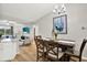 Open-concept space showcasing a dining area with access to the kitchen and the cozy living room at 3944 Sprucewood Pl, Land O Lakes, FL 34639