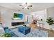 Open concept living room with breakfast bar, view of dining area, and modern furnishings at 3944 Sprucewood Pl, Land O Lakes, FL 34639
