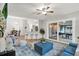 Bright living room featuring breakfast bar, open floor plan, sliding glass doors and modern furnishings at 3944 Sprucewood Pl, Land O Lakes, FL 34639