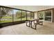 Large patio with a view of the pool and green space at 3944 Sprucewood Pl, Land O Lakes, FL 34639