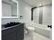 Updated bathroom boasts a large mirror, modern vanity, and stylish shower system at 4036 Cortez Dr # A, Tampa, FL 33614