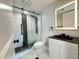 Modern bathroom features a glass-enclosed shower, decorative tile, and sleek vanity at 4036 Cortez Dr # A, Tampa, FL 33614