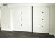 A wall of closet doors in a bedroom with dark laminate flooring at 4036 Cortez Dr # A, Tampa, FL 33614
