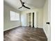 Bright bedroom with wood-look floors and a bi-fold door closet offers comfort and style at 4036 Cortez Dr # A, Tampa, FL 33614