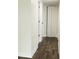 Hallway with new laminate flooring and white doors at 4036 Cortez Dr # A, Tampa, FL 33614