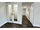 Hallway featuring wood-look flooring, french doors, and access to closet storage space at 4036 Cortez Dr # A, Tampa, FL 33614