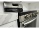 Close up of kitchen oven with quartz countertops and white cabinets and subway tile backsplash at 4036 Cortez Dr # A, Tampa, FL 33614