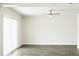Bright living room with wood-look floors and sliding glass doors at 4036 Cortez Dr # A, Tampa, FL 33614