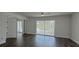 Bright living space with wood-look floors and sliding glass doors that offer views of a screened-in lanai at 4036 Cortez Dr # A, Tampa, FL 33614