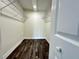 Spacious walk-in closet with wood-look floors and wire shelving provides ample storage at 4036 Cortez Dr # A, Tampa, FL 33614