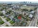 An aerial view showcases a charming neighborhood near the cityscape with mature trees and well-maintained homes at 418 W Frances Ave # 1, Tampa, FL 33602