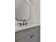 Stylish bathroom vanity with a modern faucet and decorative mirror at 418 W Frances Ave # 1, Tampa, FL 33602