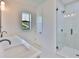 Bright bathroom featuring a double vanity, walk-in shower, and modern fixtures at 418 W Frances Ave # 1, Tampa, FL 33602