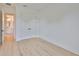 Bright bedroom featuring hardwood floors, closet, and a bathroom, offering a comfortable and stylish living space at 418 W Frances Ave # 1, Tampa, FL 33602