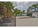 A long driveway leads to the house, lined with lush trees and landscaping, adding to the property's appeal at 418 W Frances Ave # 1, Tampa, FL 33602