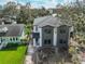 Townhome exterior in progress, featuring a modern design with visible construction amidst a green, natural setting at 418 W Frances Ave # 1, Tampa, FL 33602