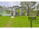 Beautiful exterior of a modern home, showcasing lush green lawns and tasteful landscaping at 418 W Frances Ave # 1, Tampa, FL 33602
