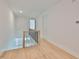 Upstairs hallway with modern railings and hardwood flooring at 418 W Frances Ave # 1, Tampa, FL 33602