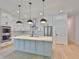 Spacious modern kitchen featuring stainless steel appliances and a central island with pendant lighting at 418 W Frances Ave # 1, Tampa, FL 33602