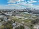 Aerial view of vacant lots near the cityscape, under a blue sky with scattered clouds at 418 W Frances Ave # 2, Tampa, FL 33602