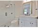 Modern bathroom with a glass-enclosed shower, sleek fixtures, and stylish white vanity at 418 W Frances Ave # 2, Tampa, FL 33602
