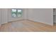 Spacious bedroom with hardwood floors and natural light from the large windows at 418 W Frances Ave # 2, Tampa, FL 33602