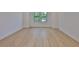 Bright bedroom featuring hardwood floors and large windows with a view of the outdoors at 418 W Frances Ave # 2, Tampa, FL 33602