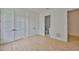 Bright bedroom featuring hardwood floors and two closet doors, providing ample storage at 418 W Frances Ave # 2, Tampa, FL 33602