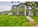 Beautifully landscaped, two story modern home with a lush green lawn and modern curb appeal at 418 W Frances Ave # 2, Tampa, FL 33602