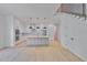 Open-concept kitchen boasts stainless appliances, large island, and bright lighting at 418 W Frances Ave # 2, Tampa, FL 33602