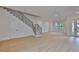 Spacious living area with hardwood floors, staircase, and plenty of natural light at 418 W Frances Ave # 2, Tampa, FL 33602