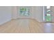 Bright and airy living area with hardwood floors and large windows allowing natural light at 418 W Frances Ave # 2, Tampa, FL 33602