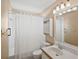 Bright bathroom featuring a shower-tub combo, vanity sink, and neutral wall color at 4320 51St S Ave, St Petersburg, FL 33711