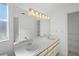Spacious bathroom with double vanity sink, ample lighting, and neutral colored walls at 4320 51St S Ave, St Petersburg, FL 33711