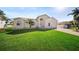 Inviting single-story home featuring a well-manicured lawn, attached garage, and classic architectural details at 4320 51St S Ave, St Petersburg, FL 33711
