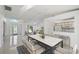 Open concept living area featuring white tile flooring, bright rooms, and seamless flow to dining and living spaces at 4320 51St S Ave, St Petersburg, FL 33711