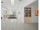 Bright, open-concept living and dining area with tile floors and natural light, seamlessly connects living spaces at 4320 51St S Ave, St Petersburg, FL 33711