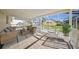 Relaxing screened patio with comfortable seating and a view of the pool at 4320 51St S Ave, St Petersburg, FL 33711