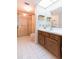 Bathroom featuring a glass shower and vanity with a sink offering functionality at 438 Mariner Dr, Tarpon Springs, FL 34689