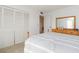 Neutral bedroom with a large closet and full-length mirror offers ample storage at 438 Mariner Dr, Tarpon Springs, FL 34689